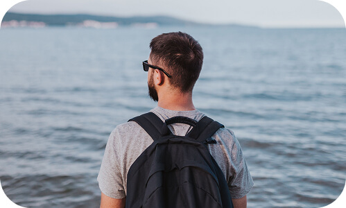 New Zealand employee enjoying a day off looking out at the ocea
