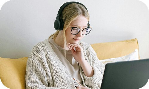 New Zealand female employee working on laptop source httpswww.pexels.comphotophoto of woman taking notes 4458554