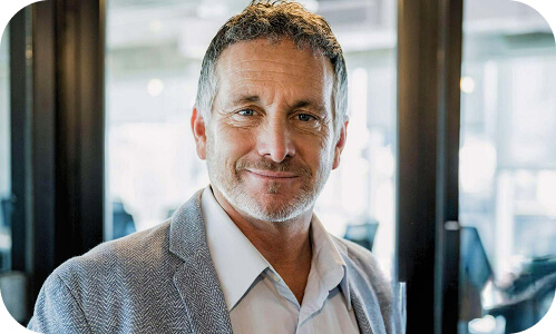 Owner of small New Zealand business in the workplace office