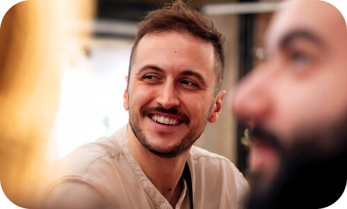 New Zealand employee smiling at conference speaker event