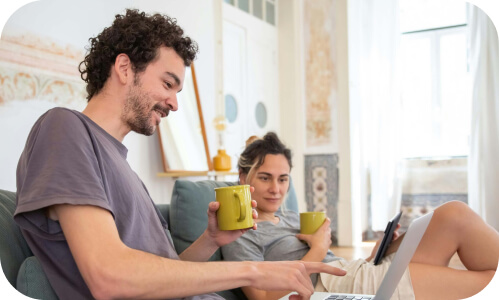 New Zealanders at home working in their lounge