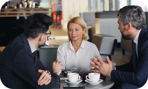 Senior leaders having a coffee during a meeting